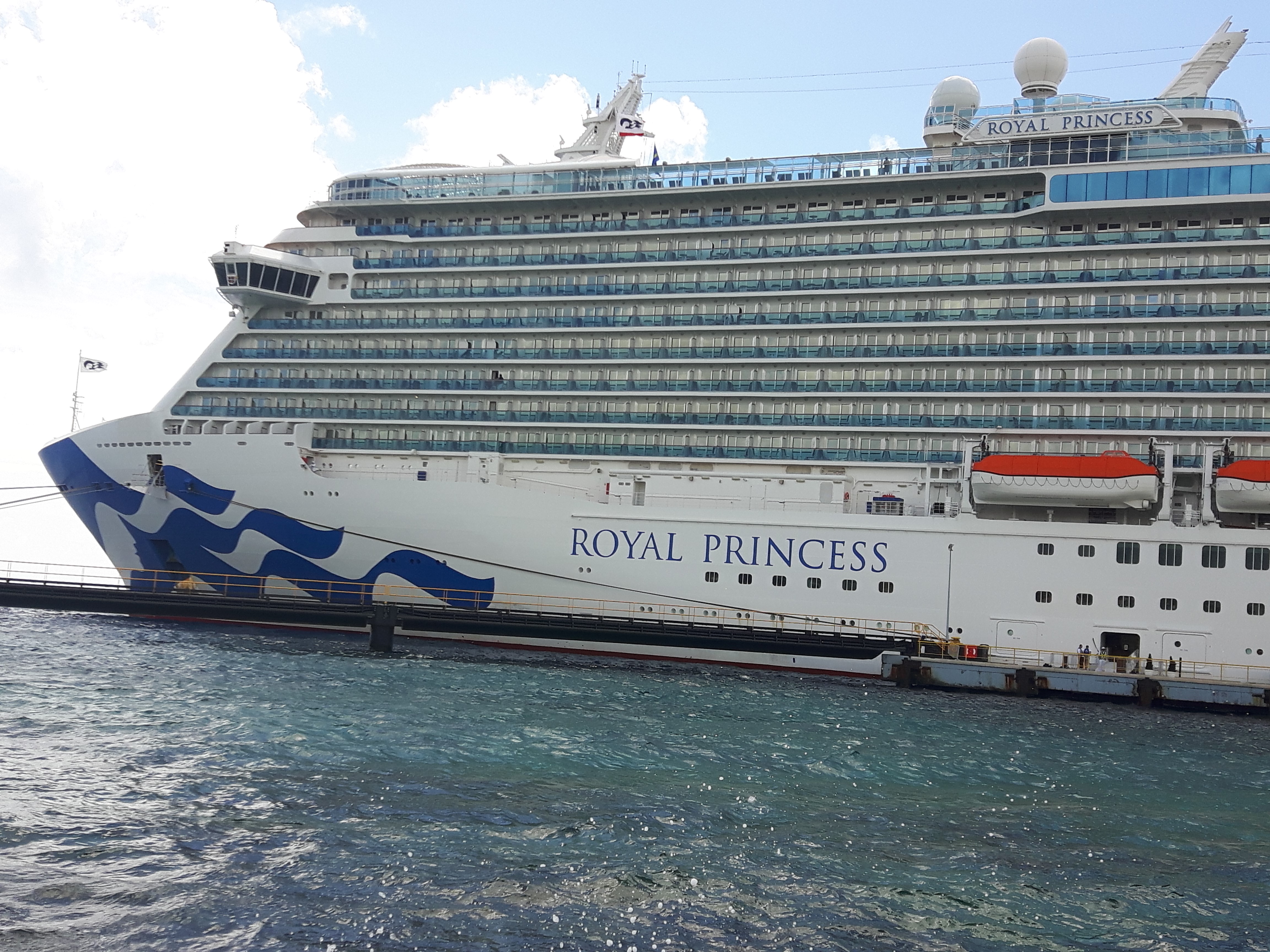 Watch the cruise ships enter port and do some people watching for a free activity when visiting Curacao