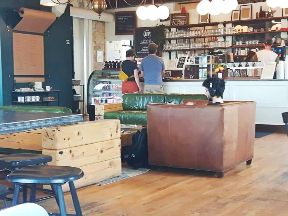 Enjoy coffee in a comfortable atmosphere at Smile Tiger Coffee Roasters when visiting Kitchener, Ontario